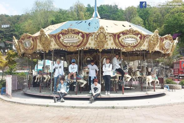 BTS on the carousel at Yongma Land!