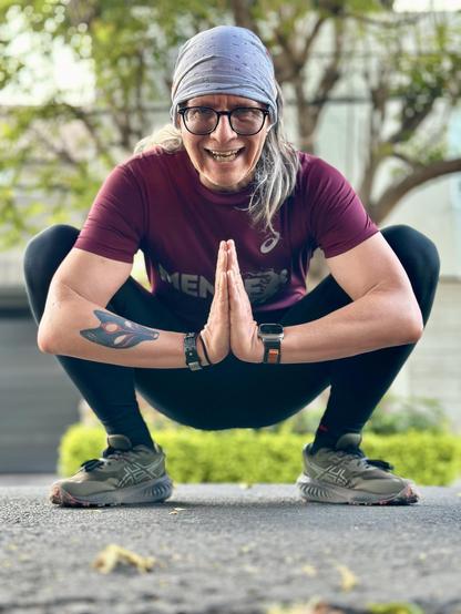 Me squatting before the camera after my morning run