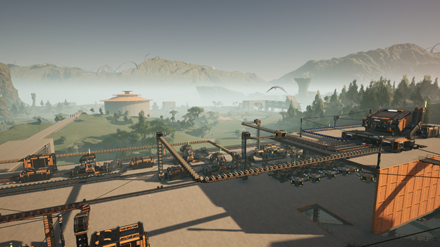 My starter base is a mess of conveyor belts crisscrossing a large raised concrete slab. A round building can be seen in the distance which houses a bank of batteries.