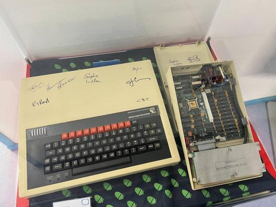 [ImageSource: Richard Speed]

BBC Micro signed by Arm co-designer Sophie Wilson and her co-boffins at the Centre For Computing History, Cambridge. 

The computer, a familiar sight in classrooms throughout the UK and plugged into the televisions of well-heeled parents, allowed the attachment of a second processor. There was a unit with an additional 6502 processor, another contained a Z80 processor. And this one could accept Acorn's new RISC chip, freshly stamped out by VLSI.

At 3pm on April 26, 1985, having been plugged into the test board attached to the BBC Micro, power was introduced and the processor worked. Sophie Wilson, author of BBC BASIC and one of the brains behind the Arm chip, copied an Arm version of the BASIC interpreter and tried a command. Everything checked out.

"It did not say, 'Hello world, I am Arm,'" laughed Wilson at the CCH event. "I think that's one of Hermann's [Hermann Hauser, who set up Acorn Computer with Chris Curry] apocryphal stories! But it did say Pi."