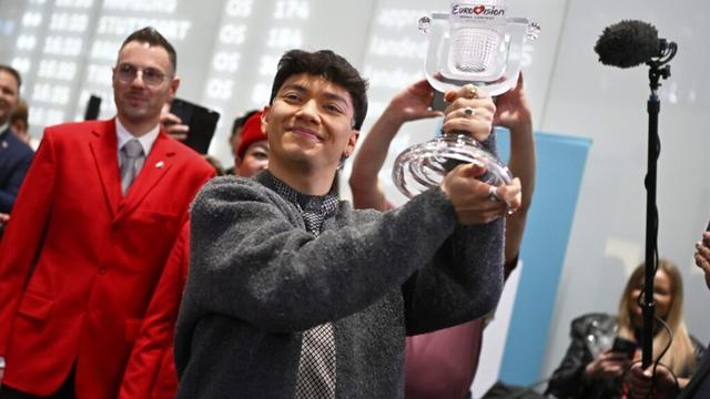 Austria welcomes JJ back home with cheers, hugs and roses after winning Eurovision Song Contest