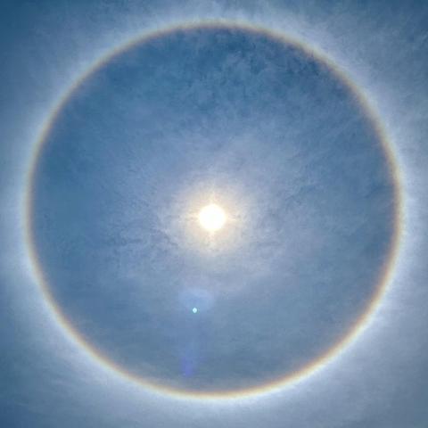 Photo of the sun surrounded by a halo