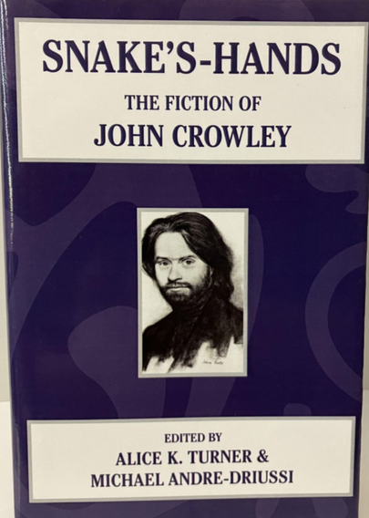 The cover of Snake's-Hands.  A portrait of a youngish white man with long brown hair and a brown beard on a deep purple background.  The title is in purple text on a white square above the portrait.