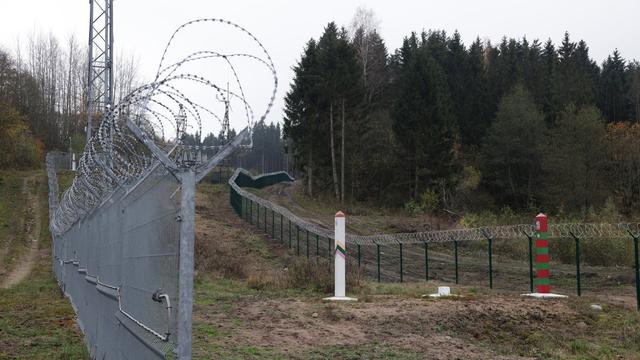 A Lithuanian border fence and marker face a Russian border marker at the Russian semi-exclave of Kaliningrad. | Getty Images