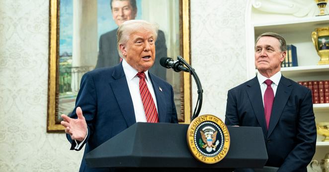 President Trump swearing in the new ambassador to China, David Perdue, in the Oval Office on Wednesday.