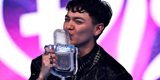 Austrian singer JJ representing Austria with the song "Wasted Love" celebrates with the 2025 Eurovision Song Contest trophy after winning the grand final in Basel on 18 May 2025. FABRICE COFFRINI / AFP