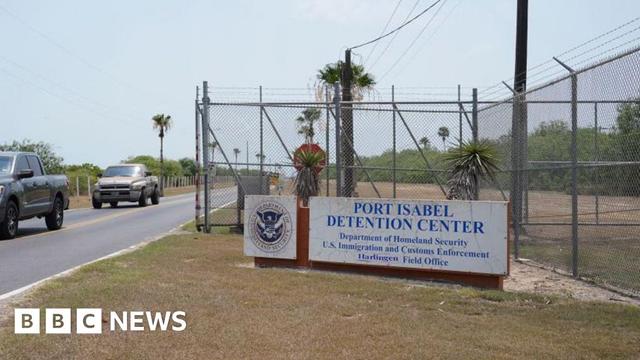 The entrance to The Port Isabel Detention Center is seen after a media tour hosted by U. S. Immigration and Customs Enforcement (ICE) Harlingen Enforcement and Removal Operations (ERO), in Los Fresnos, Texas, June 10, 2024. Behind barbed metal fences topped with barbed wire, men play volleyball and basketball at a detention center in Texas, passing time as they wait to hear if they will be allowed to stay in the United States.