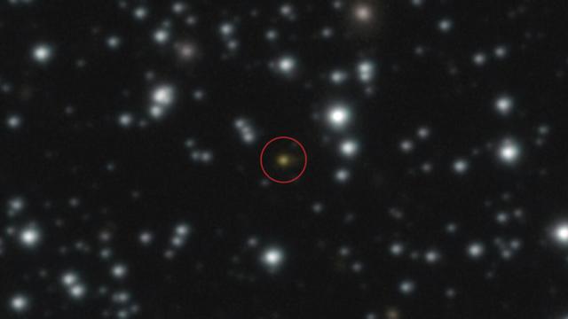 This image provided by the European Southern Observatory shows a powerful explosion, orange dot at the center of the image, that repeated several times over the course of a day, The image, taken with ESO's Very Large Telescope (VLT), allowed astronomers to determine that the explosion didn't take place in the Milky Way but in another galaxy. (European Southern Observatory via AP) This image provided by the European Southern Observatory shows a powerful explosion, orange dot at the center of the image, that repeated several times over the course of a day, The image, taken with ESO's Very Large Telescope (VLT), allowed astronomers to determine that the explosion didn't take place in the Milky Way but in another galaxy. (European Southern Observatory via AP)